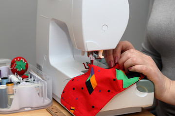 Sewing of a homemade face mask to protect and prevent against infection and outbreaks of infectious diseases.