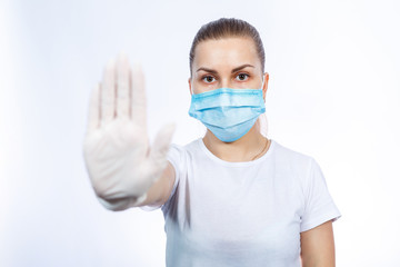 woman health worker in protective medical surgical mask against the virus. Isolated on white background