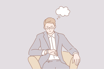 Waiting for meeting, delay business concept. Dissatisfied businessman clerk manager boss sits in chair, looks at watches, checks time. Waiting for delayed employee, job interview, business meeting.