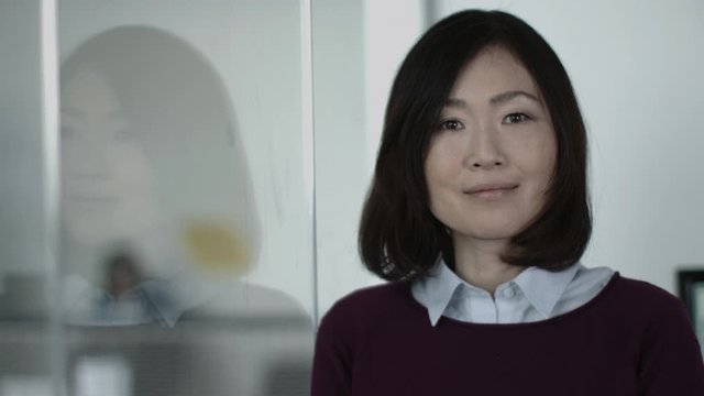 Portrait of Japanese business woman in office