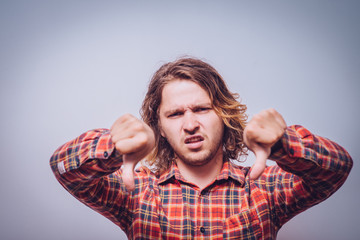man showing a thumb down gesture