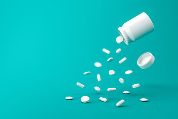 White pills bottle of aspirin tablets on green background with pharmacy and splashing concept....