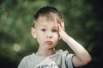 close-up portrait of a little boy with blond hair