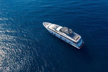 Aerial drone photo of a luxury yacht of the coast of Isola de Ischia, Italy