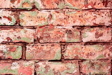 Texture of a brick wall with cracks and scratches which can be used as a background