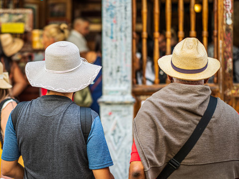 two persons in straw hats