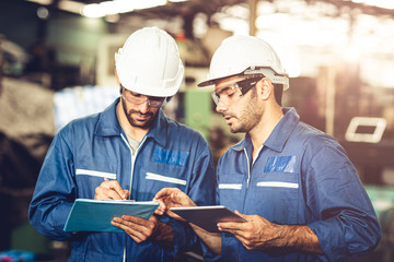 Engineer audit worker working team together with safety uniform and white helmet to work in...
