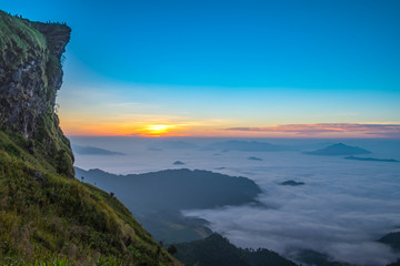 Fototapeta premium Morning sunrise with fog on Phu Chee Fah in Chiang Rai, Thailand.