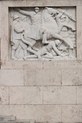 Marble relief with war scene of the fascist period. Rome, Italy.