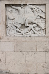 Marble relief with war scene of the fascist period. Rome, Italy.