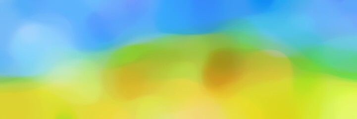unfocused bokeh horizontal banner background texture with yellow green, sky blue and dodger blue colors space for text or image