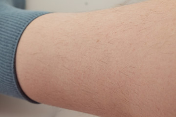  unshaven, hairy legs of a woman before hair removal. concept of smooth skin without hair, spa concept
