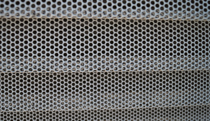 Metallic gray background texture pattern of metal mesh vehicle macro
