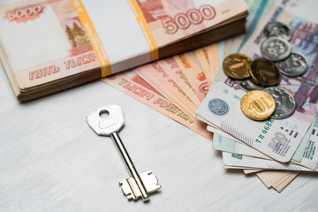 the key lies next to the bundles of Russian rubles