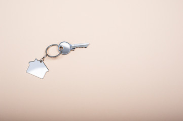 Closeup of the key with house shaped keychain