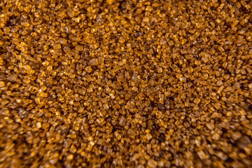 Detail of texture of beautiful brown sugar grains, macro photography