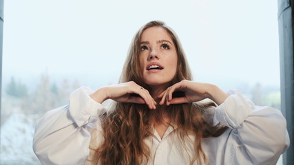 Red-Haired Girl Plays With Her Long Hair.