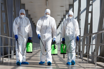 Protection measures by specialists in coronavirus hazmat suits