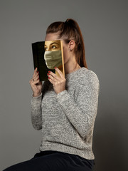 Happy world book day 2020, be safe and read to become someone else - woman covering face with book...