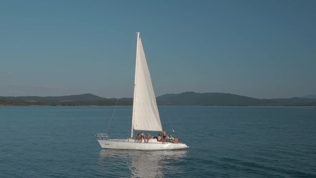Aerial view of men on bachelor party on sailing boat in lake