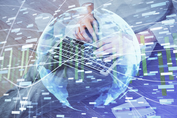 Double exposure of businessman working on laptop on background. International business hologram in front. Concept of success.