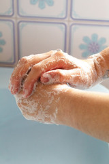 Fototapeta premium washing hands in a normal house, corona virus disinfection, pandemic, hygiene quarantine