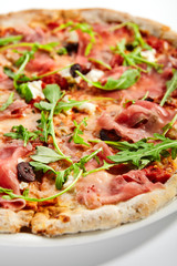 Pizza with parma ham and artichoke