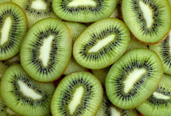 fresh green kiwis slices background