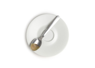 Saucer and coffee spoon, isolated on white background, top view