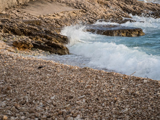 Tide coming on pebble beach in Croatia