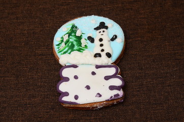 Snowman shaped cake decorated with candy