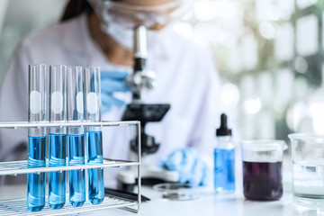 Biochemistry laboratory research, Chemist is analyzing sample in laboratory with Microscope...