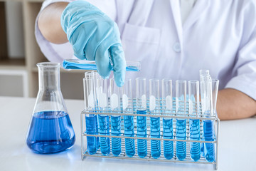 Scientist or medical in lab working in biotechnological laboratory using equipment for research...