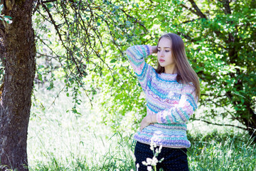 Beautiful model posing in spring park