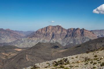 Mountain and valley view along Wadi Sahtan road in Al Hajir mountains between Nizwa and Mascat in Oman
