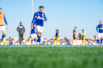silhouettes of soccer players during game in soccer. blurry
