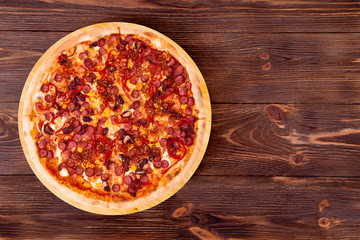 Pizza Mexico on bamboo bottom, on wooden table top view, space for text