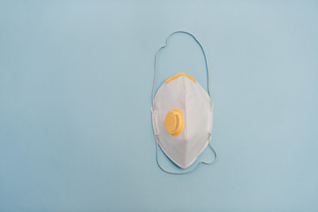 medical white masks on a blue background, respiratory protective bandage with valve. Sale, for...