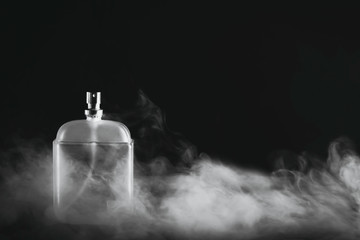 Bottle of men's fragrance on a dark background
