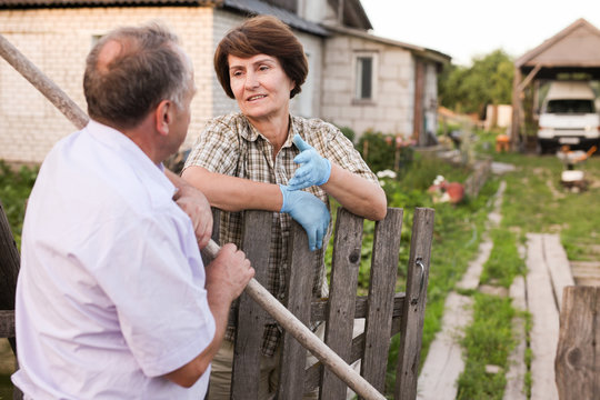 Farm Neighbors Talking At The Fence