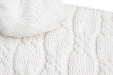 Cables knit stitch pattern, handmade knitted clothes texture, knitting needles and yarn, decorative design for cardigans and sweaters. Hobby and leisure time motif