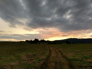 Obraz premium Sunrise or sunset over the hills and meadow. Slovakia