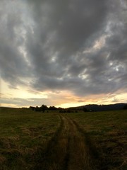 Fototapeta premium Sunrise or sunset over the hills and meadow. Slovakia