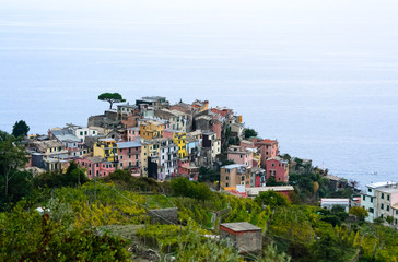 Fototapeta na wymiar Nice aerial landscape view of the little town of Corniglia in the Cinque Terre in Liguria Italy. It is a small colorful village perched on the rocks with a fantastic view of the Mediterranean sea