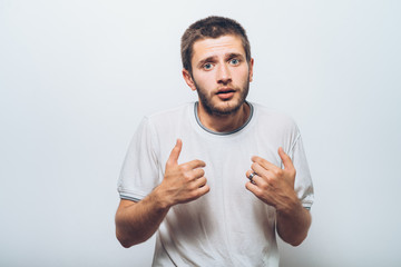 Male hand forefinger pointing to himself on the chest. Gesture. who am i. On a gray background