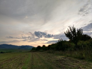 Sunrise or sunset over the hills and meadow. Slovakia