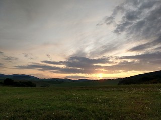 Sunrise or sunset over the hills and meadow. Slovakia