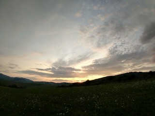 Sunrise or sunset over the hills and meadow. Slovakia