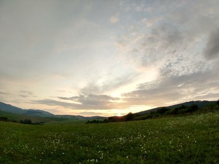 Sunrise or sunset over the hills and meadow. Slovakia
