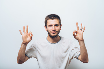 Fototapeta premium man shows that everything is fine, do not worry. all okay. Gesture. Close portrait.